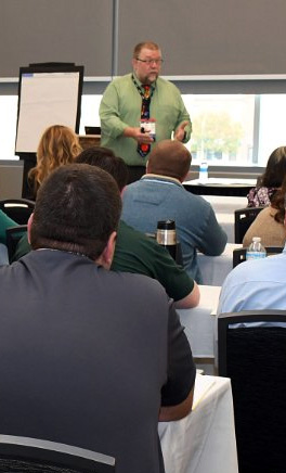 Image of Instructor in front of classroom