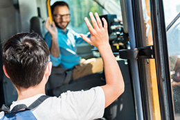 Child boarding a school bus