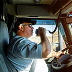 Truck driver talking on his radio