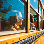 Kids riding a school bus