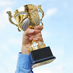 hand raising a trophy
