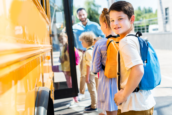 Children boarding a school bus