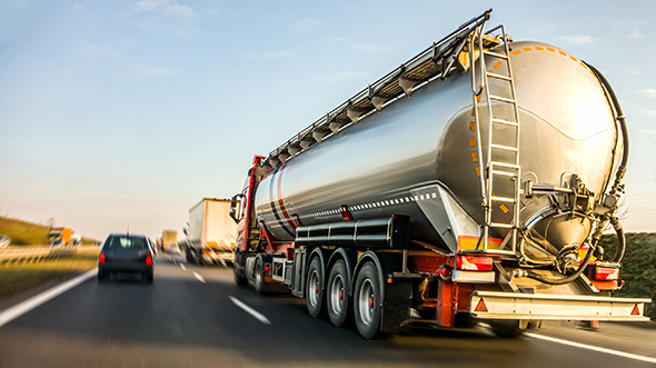 Semi-Truck running at sunset