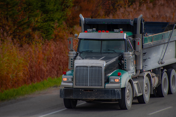 Semi-Truck running at sunset